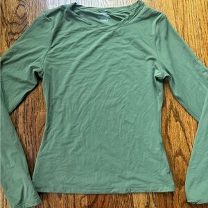 Tight green long sleeve shirt